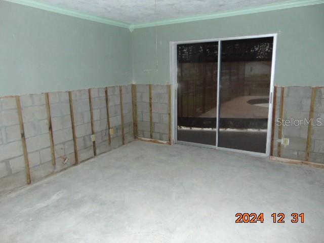 2044 Montana Avenue Northeast St. Petersburg, FL 33703 - Photo 35 of 53 an empty room with sliding glass door
