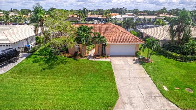 a front view of a house with a plant