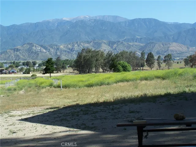 a view of a town with mountains in the background