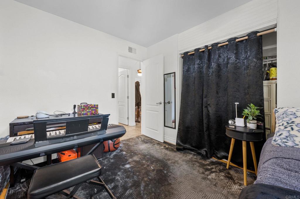3470 Peach Tree Way Oceanside, CA 92058 - Photo 13 of 21 a living room with furniture a piano and wooden floor
