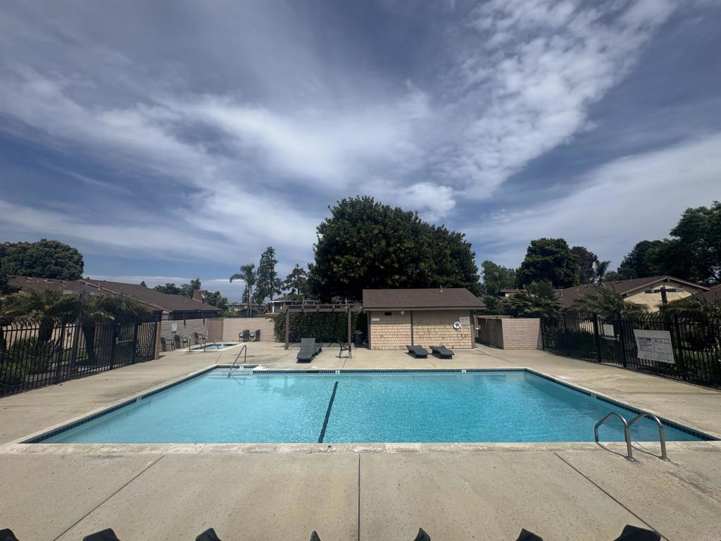 3470 Peach Tree Way Oceanside, CA 92058 - Photo 18 of 21 a view of a swimming pool with a chair and tables