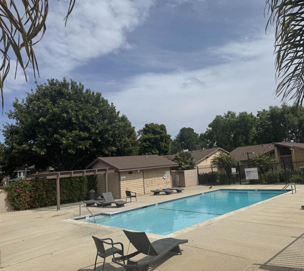 3470 Peach Tree Way Oceanside, CA 92058 - Photo 19 of 21 a roof deck with table and chairs a barbeque