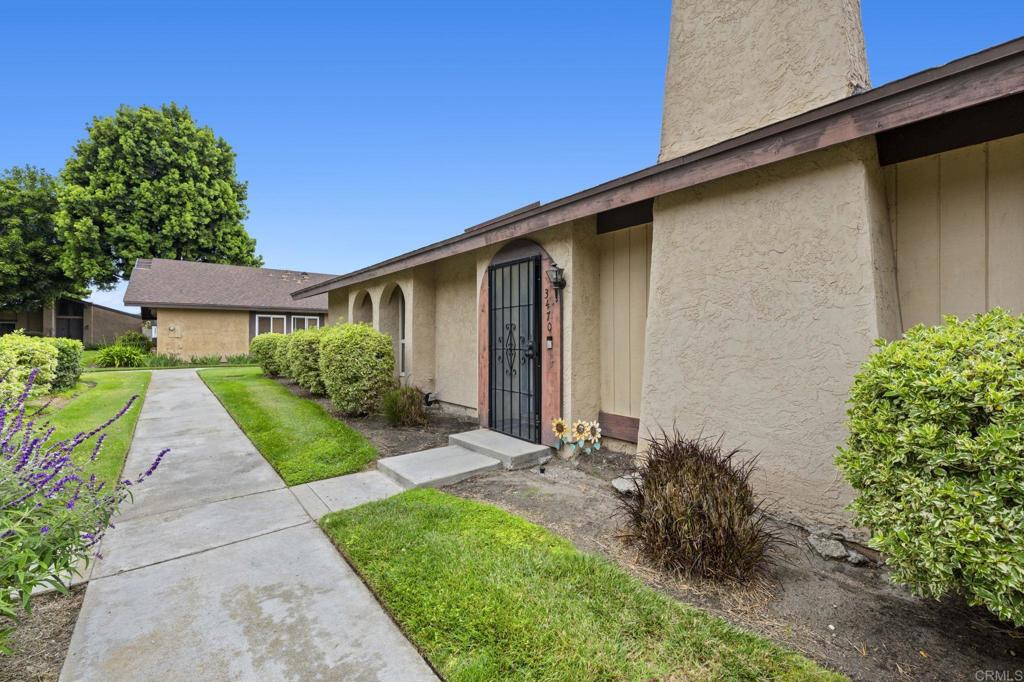 3470 Peach Tree Way Oceanside, CA 92058 - Photo 21 of 21 a front view of a house with a yard and potted plants