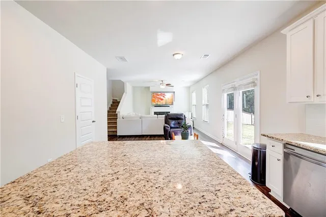 a view of a bedroom with closet and windows