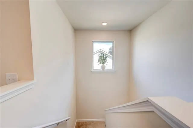 a view of a hallway with closet