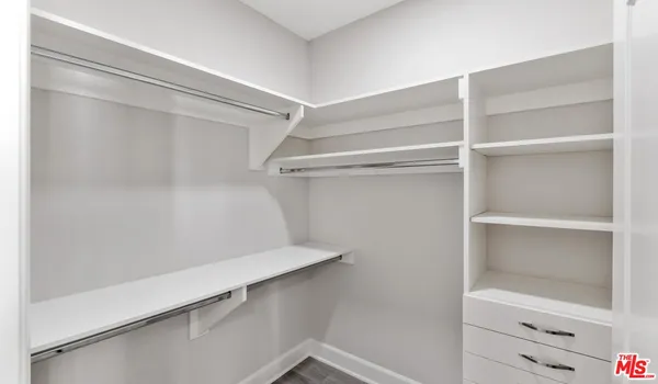 a view of an empty walk in closet