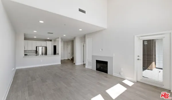 a view of kitchen with furniture and a fireplace