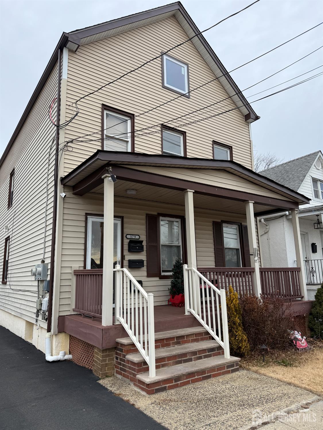 579 Florida Grove Road Perth Amboy, NJ 08861 - Photo 2 of 14 a view of a house with a small yard