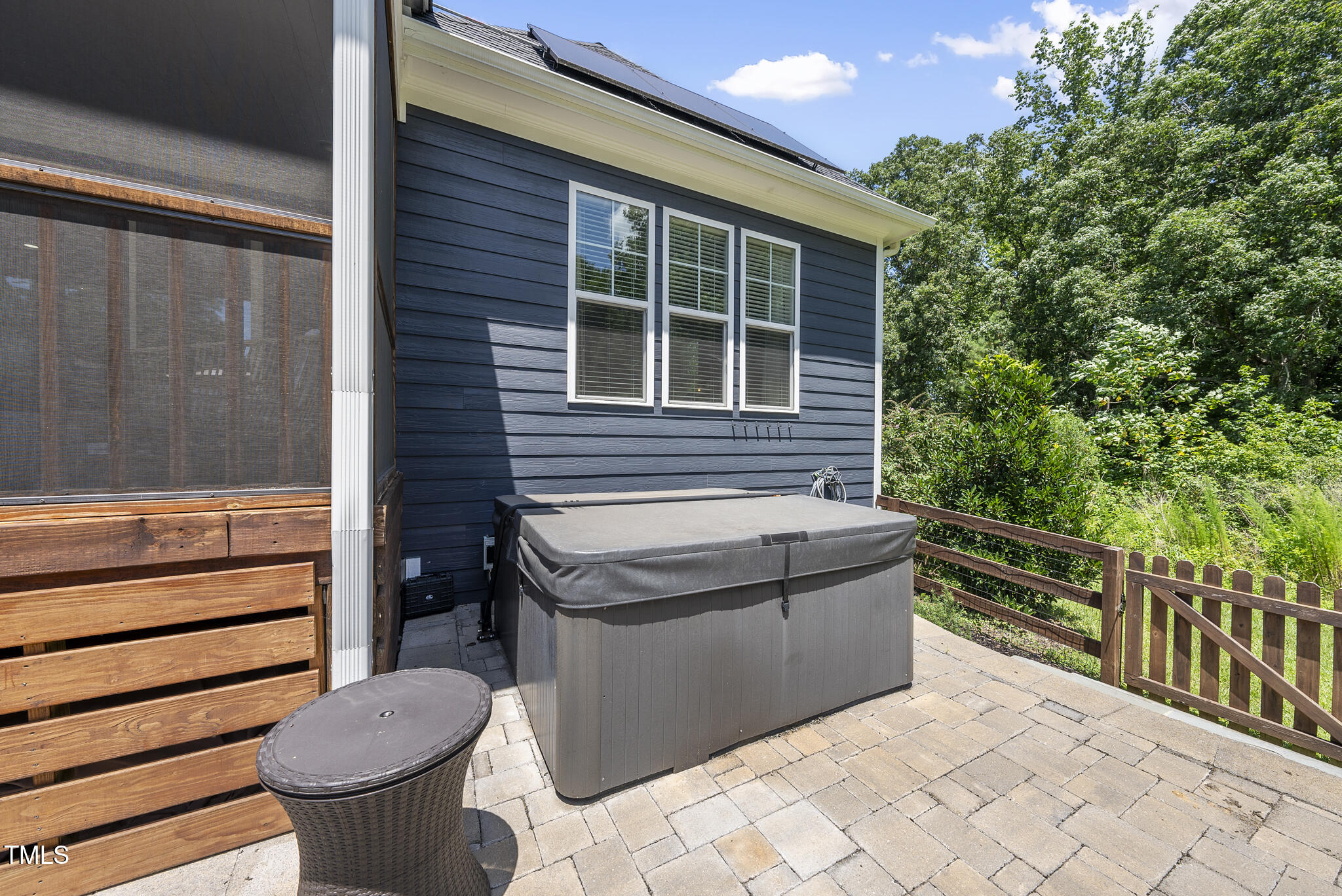 2416 Eddie Howard Road Willow Spring, NC 27592 - Photo 17 of 64 a view of a patio with a table and chairs