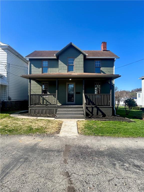 103 Memorial Street Dunbar, PA 15431 - Photo 2 of 29 a front view of a house with a yard
