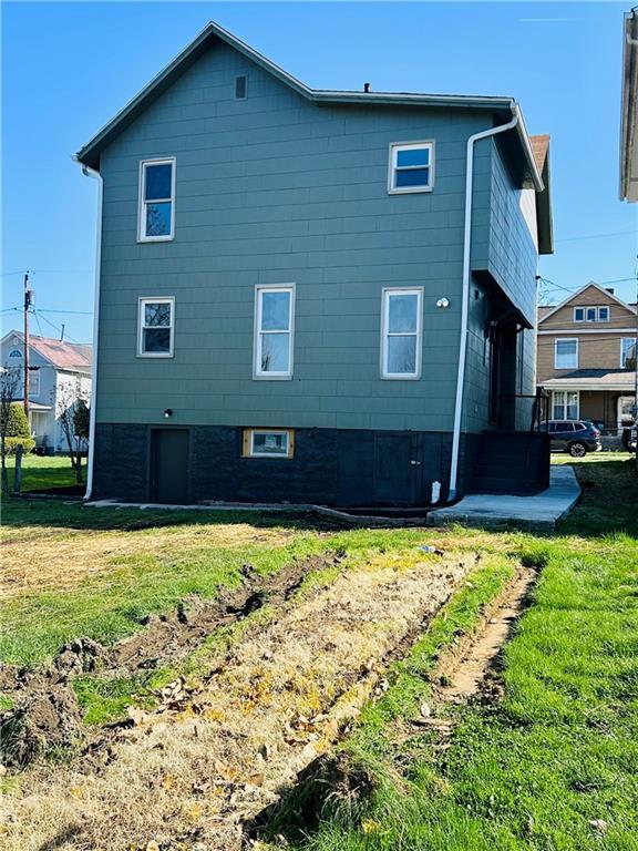 103 Memorial Street Dunbar, PA 15431 - Photo 28 of 29 a view of a house with a yard