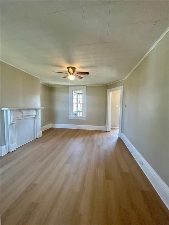 103 Memorial Street Dunbar, PA 15431 - Photo 3 of 29 wooden floor in an empty room with a window