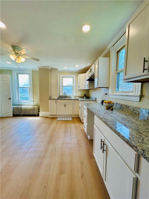103 Memorial Street Dunbar, PA 15431 - Photo 4 of 29 a large kitchen with granite countertop a large counter top space a sink stainless steel appliances and cabinets