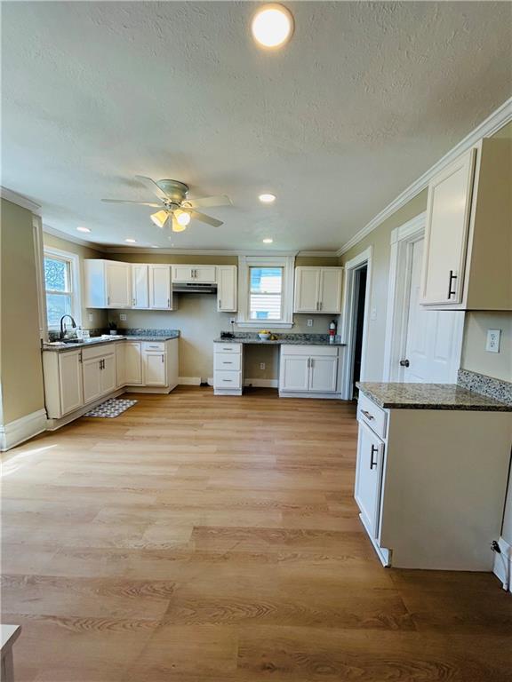 103 Memorial Street Dunbar, PA 15431 - Photo 5 of 29 a large kitchen with stainless steel appliances granite countertop a lot of cabinets and wooden floor