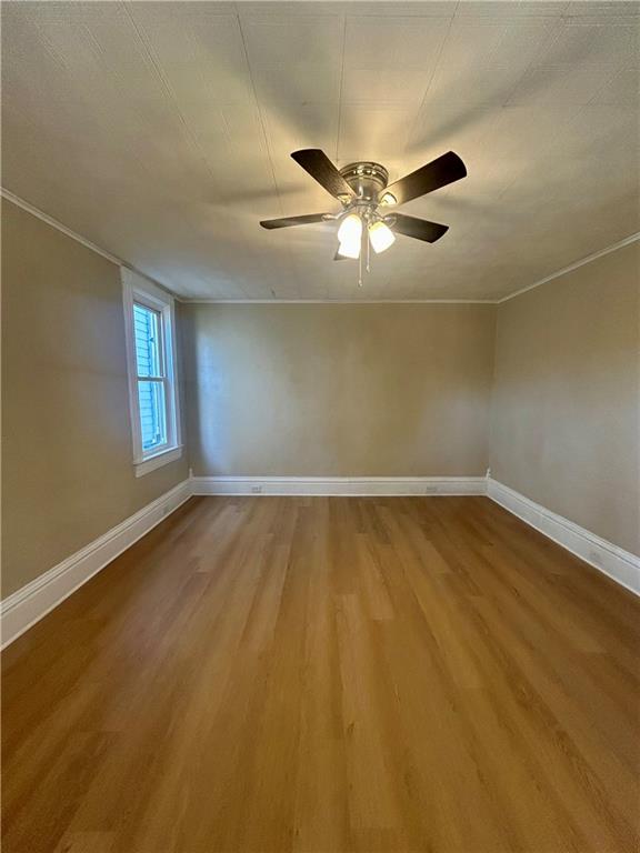 103 Memorial Street Dunbar, PA 15431 - Photo 8 of 29 an empty room with a window and a ceiling fan
