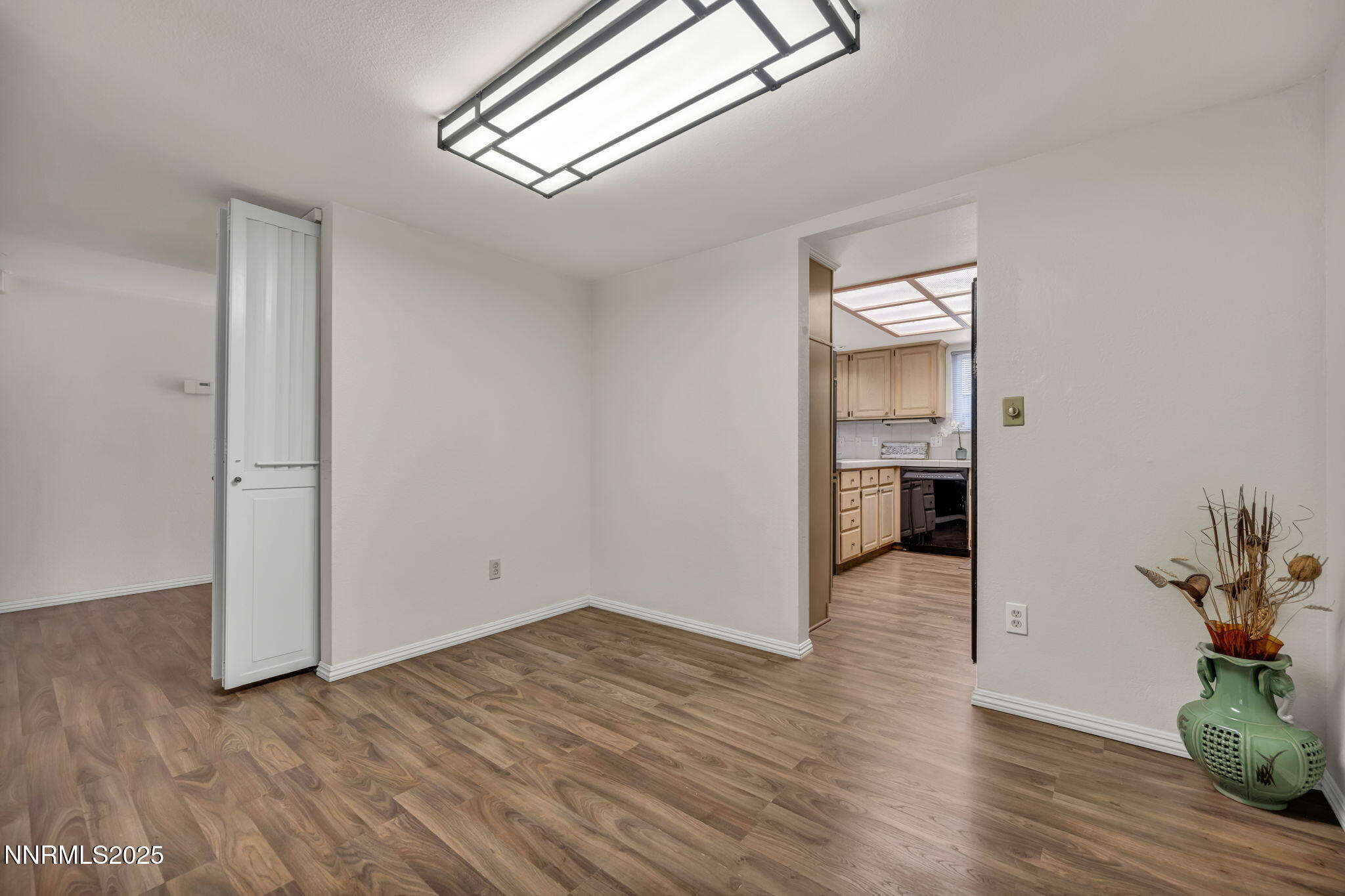 1481 Foster Drive Reno, NV 89509 - Photo 19 of 52 a view of empty room with wooden floor