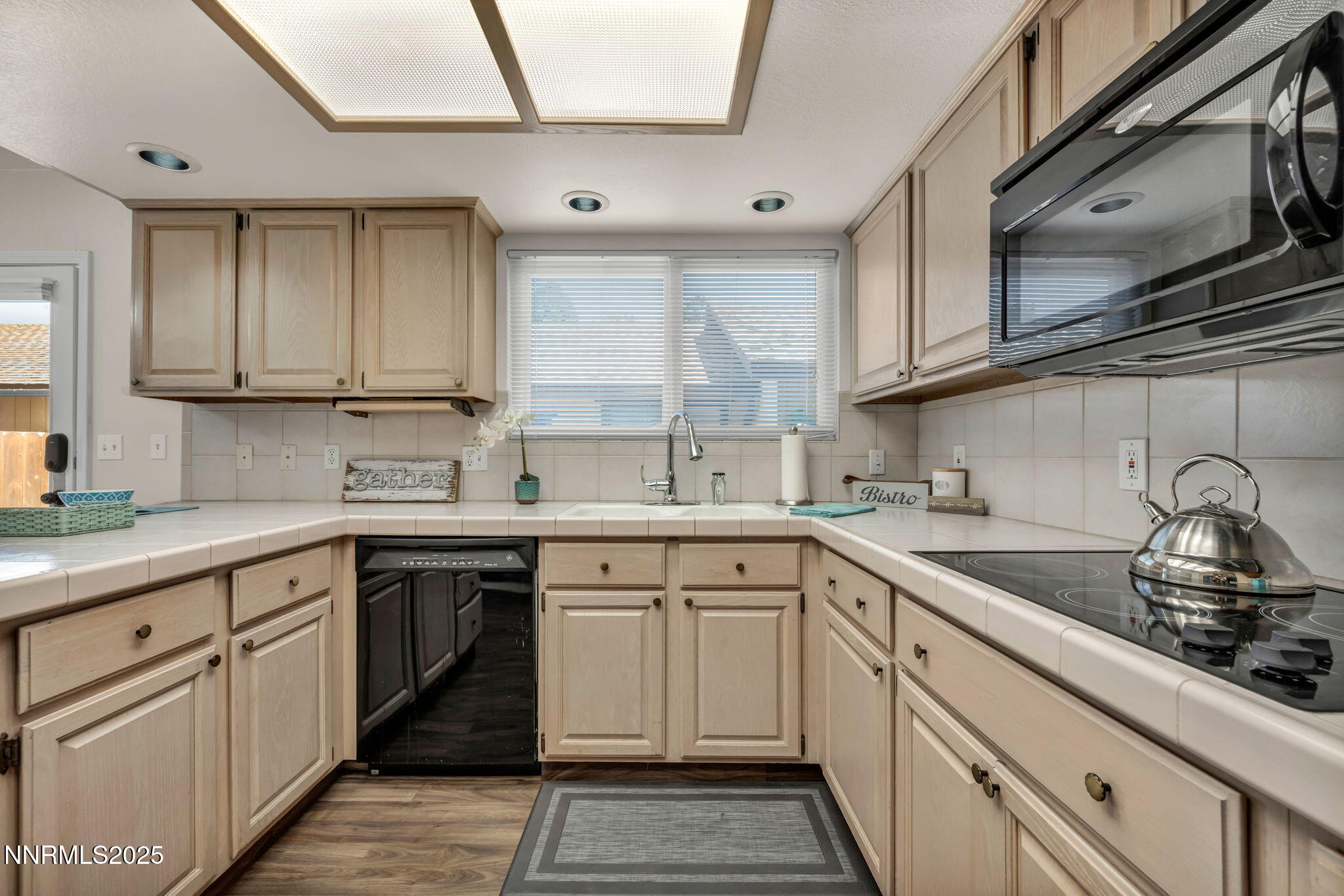 1481 Foster Drive Reno, NV 89509 - Photo 2 of 52 a kitchen with cabinets appliances a sink and a window