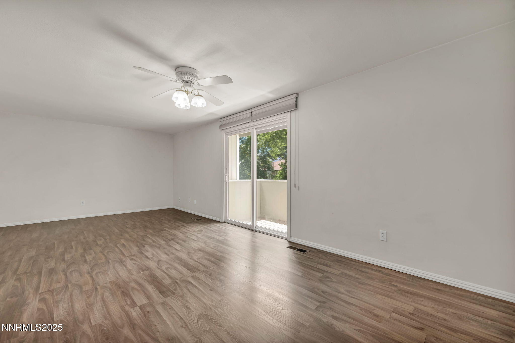 1481 Foster Drive Reno, NV 89509 - Photo 28 of 52 a view of an empty room with wooden floor and a window