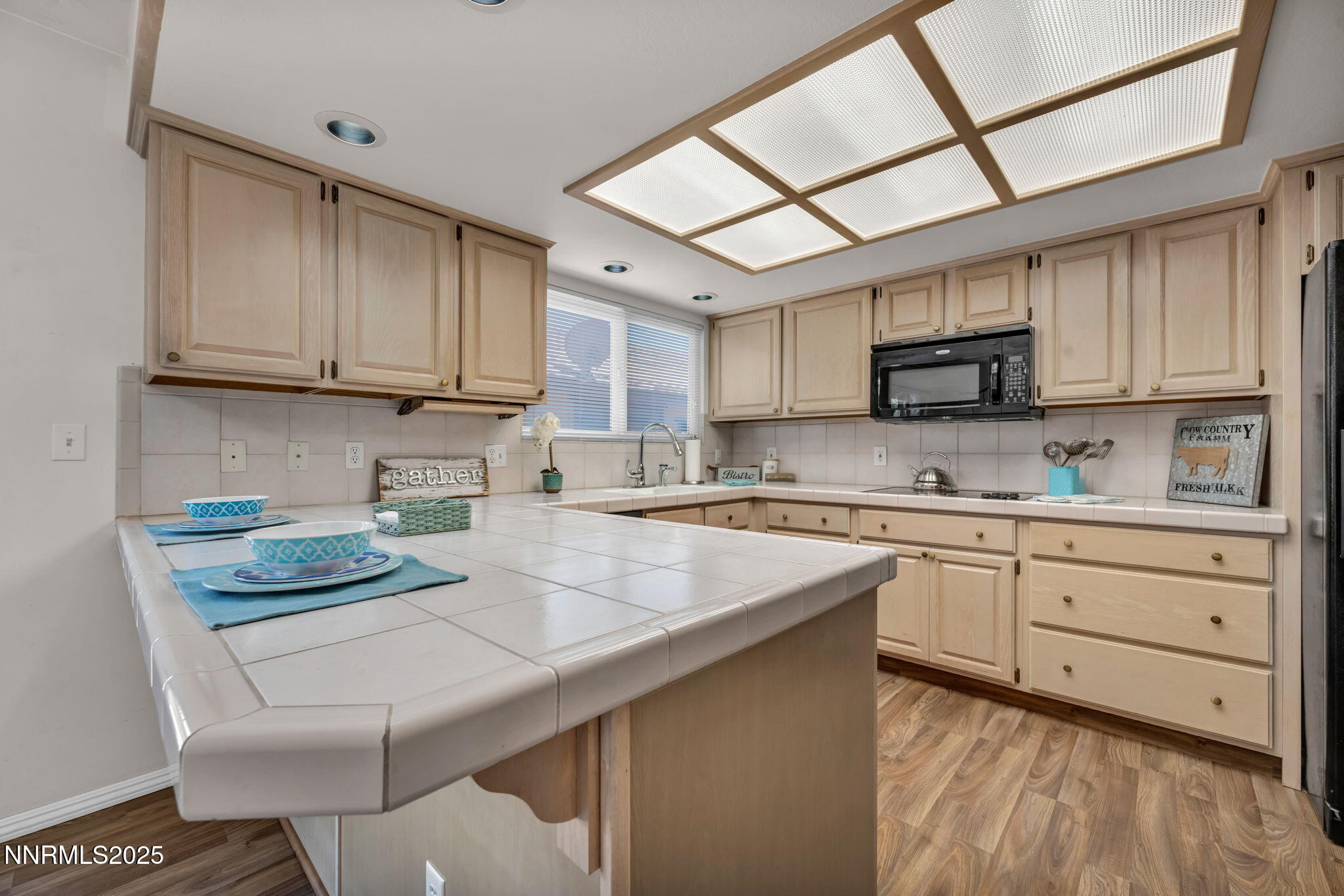 1481 Foster Drive Reno, NV 89509 - Photo 3 of 52 a kitchen with kitchen island granite countertop a sink cabinets and stainless steel appliances