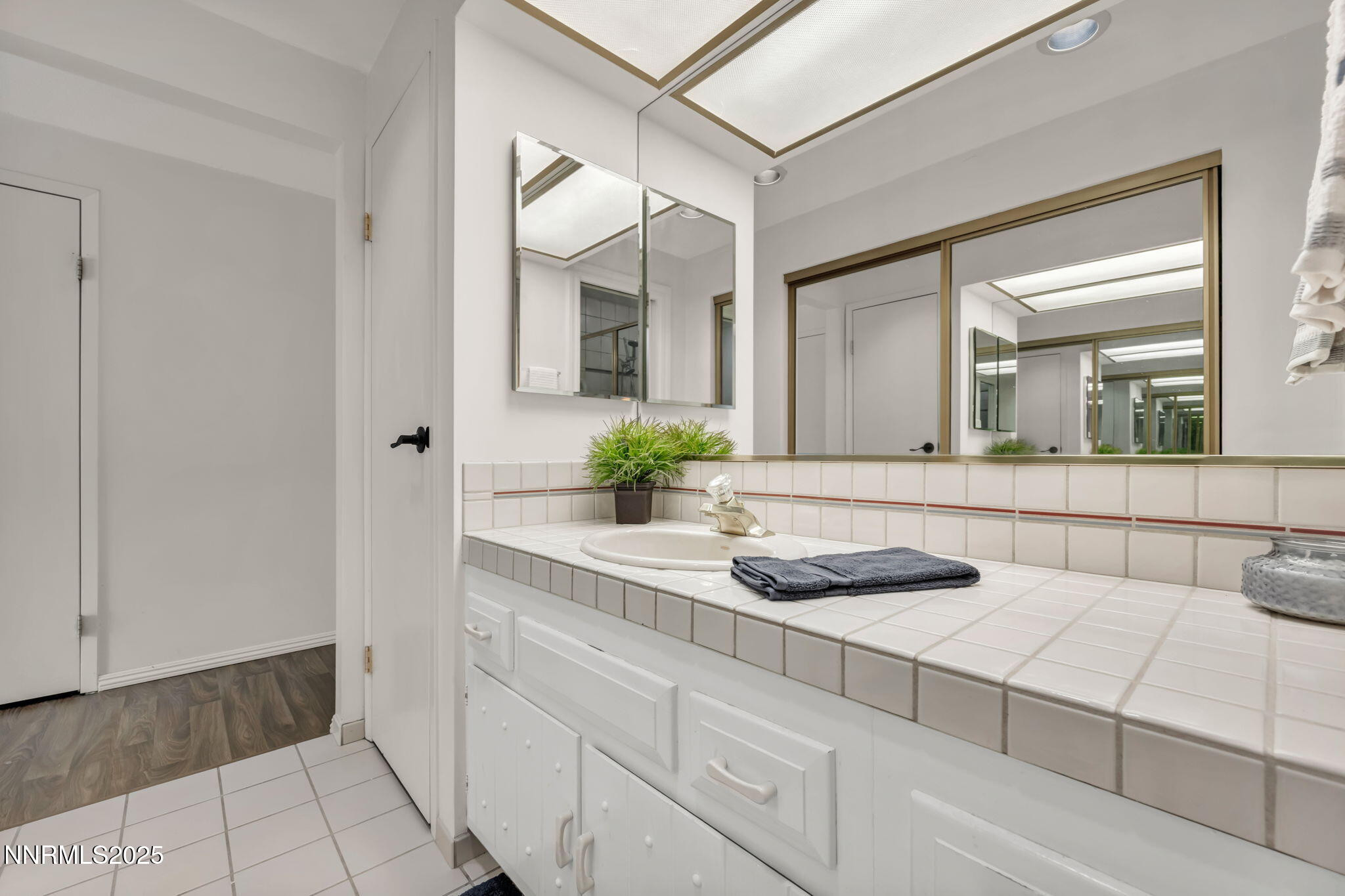 1481 Foster Drive Reno, NV 89509 - Photo 32 of 52 a bathroom with a sink and a mirror