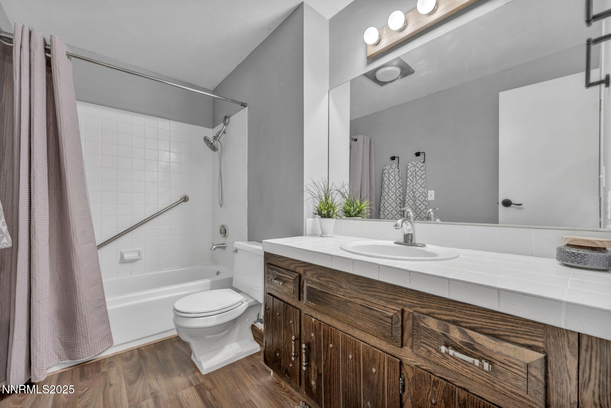 1481 Foster Drive Reno, NV 89509 - Photo 39 of 52 a bathroom with a granite countertop sink toilet mirror and shower
