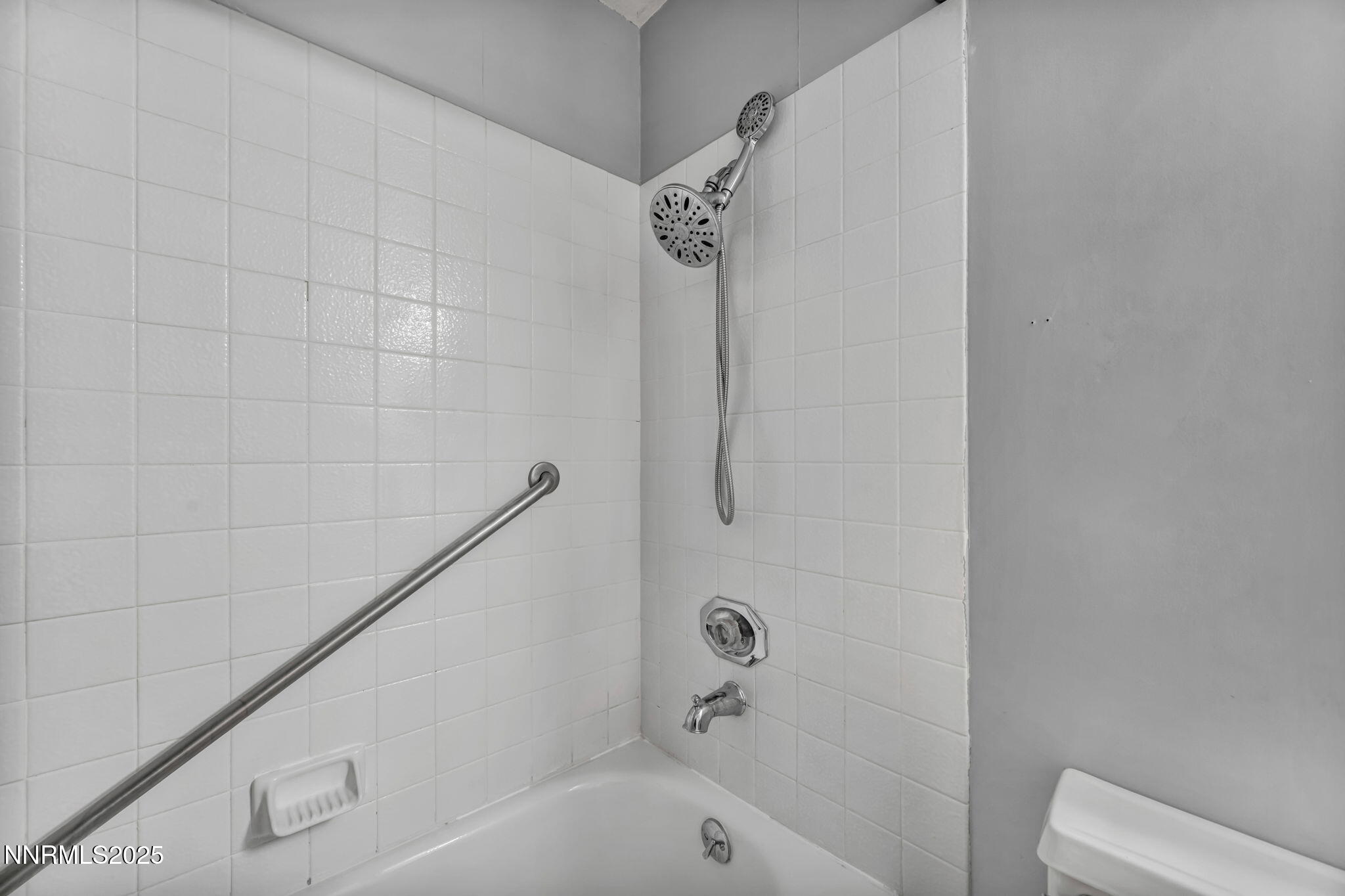 1481 Foster Drive Reno, NV 89509 - Photo 40 of 52 a bathroom with a bathtub and shower