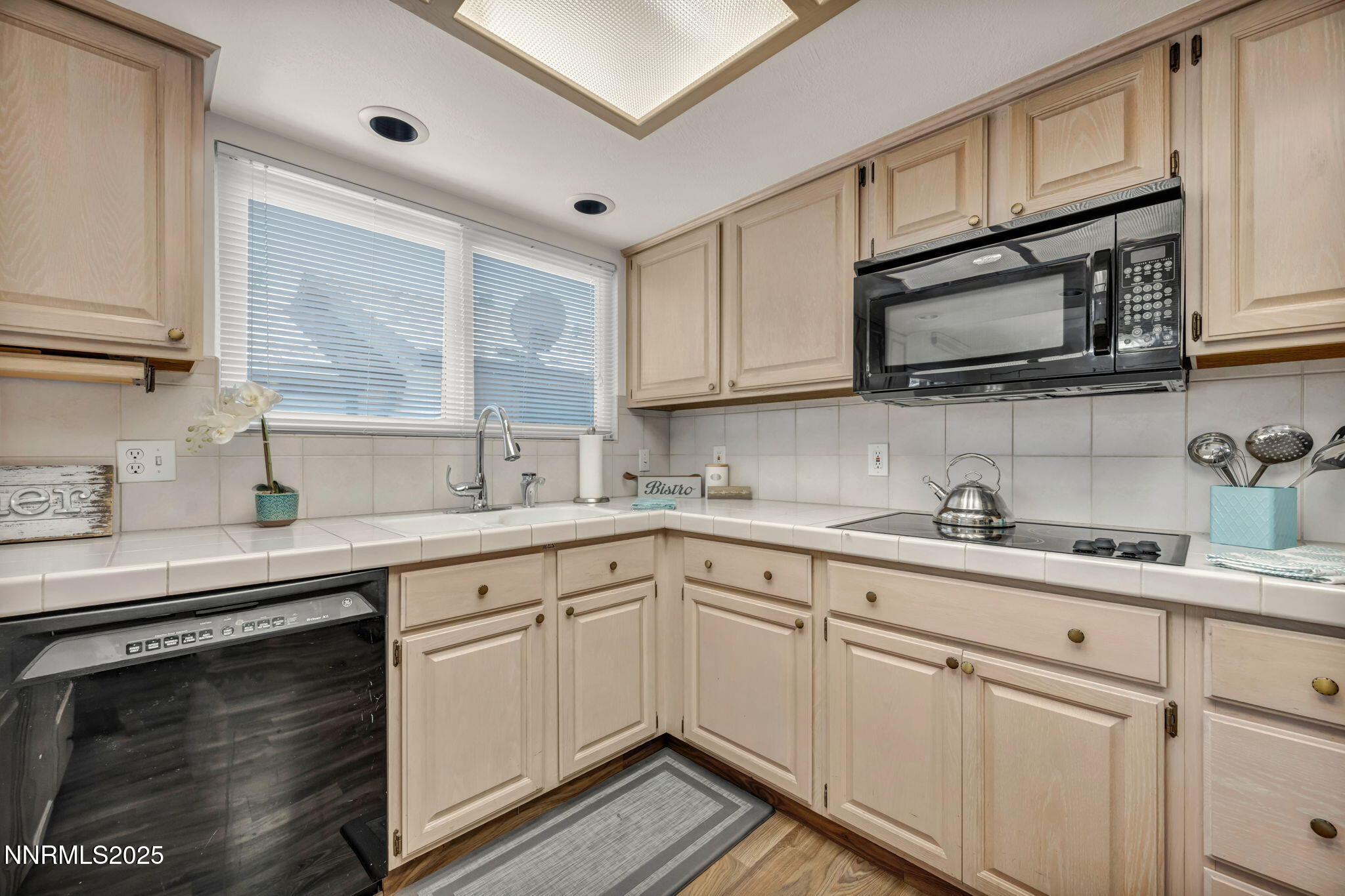 1481 Foster Drive Reno, NV 89509 - Photo 4 of 52 a kitchen with cabinets appliances a sink and a window
