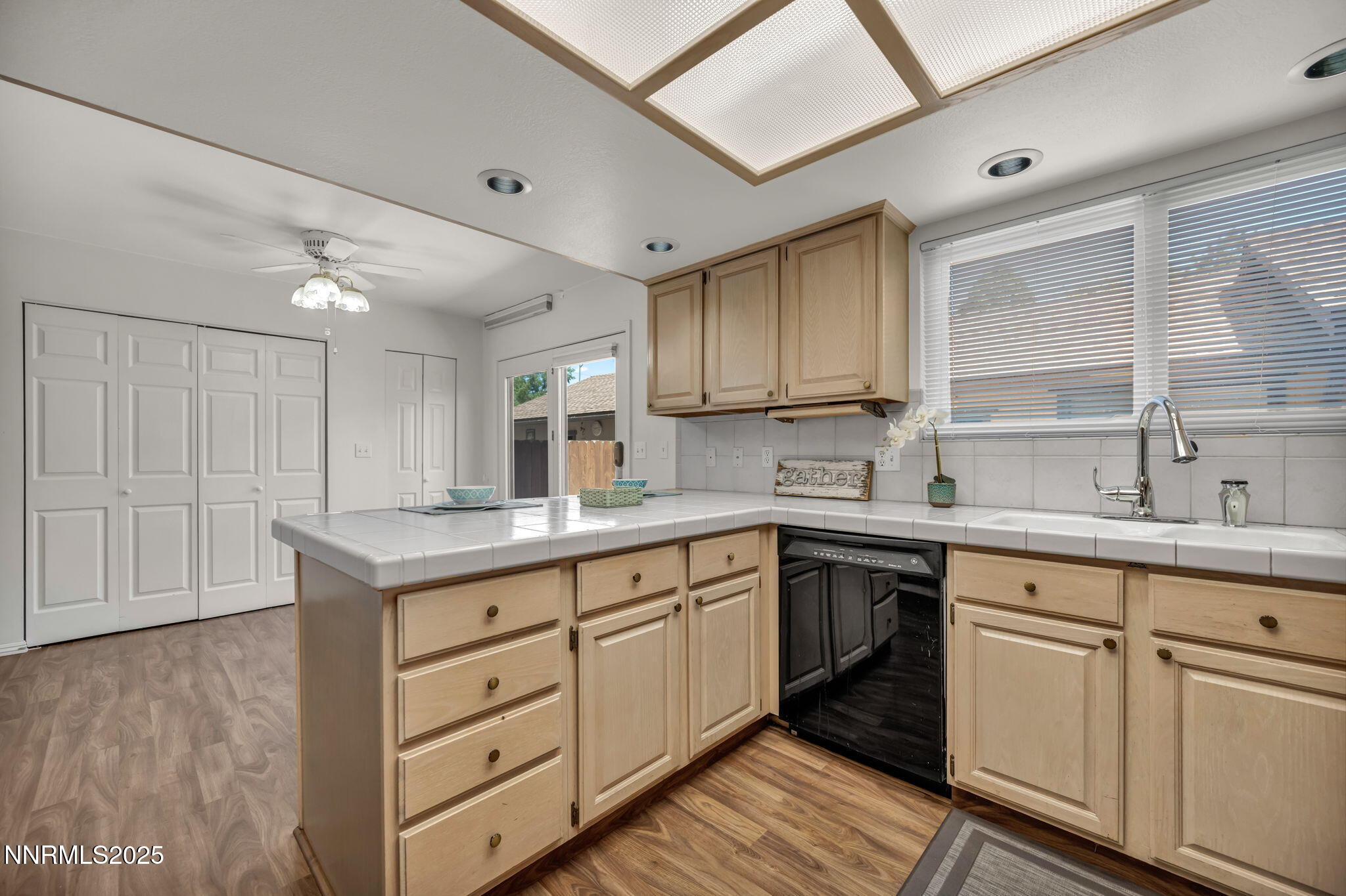 1481 Foster Drive Reno, NV 89509 - Photo 43 of 52 a kitchen with white cabinets and sink