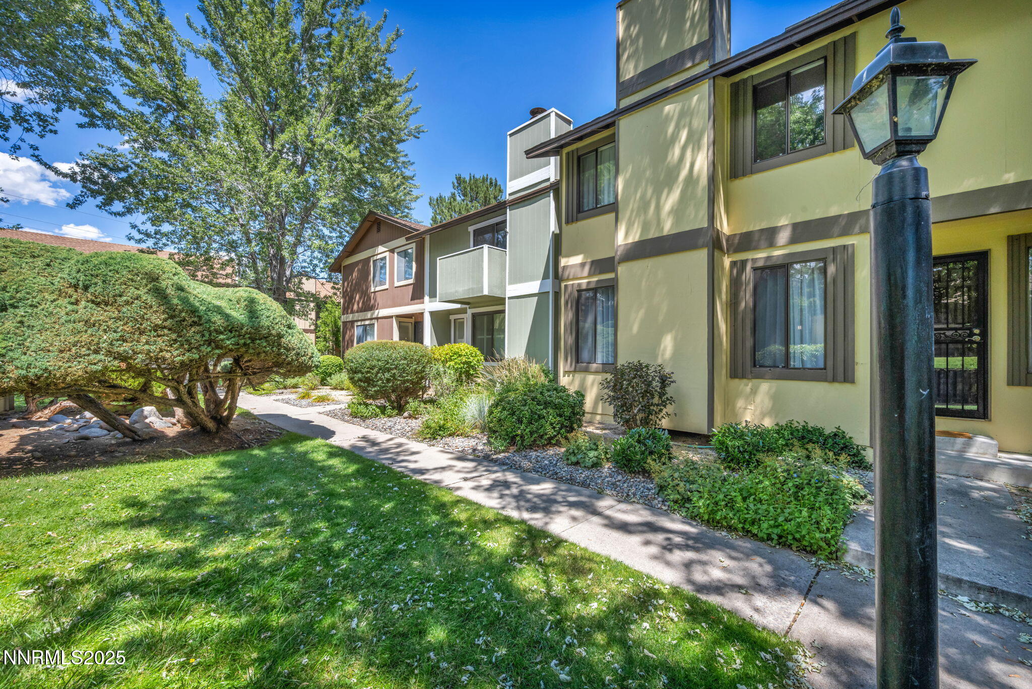 1481 Foster Drive Reno, NV 89509 - Photo 47 of 52 a view of a brick house with a yard
