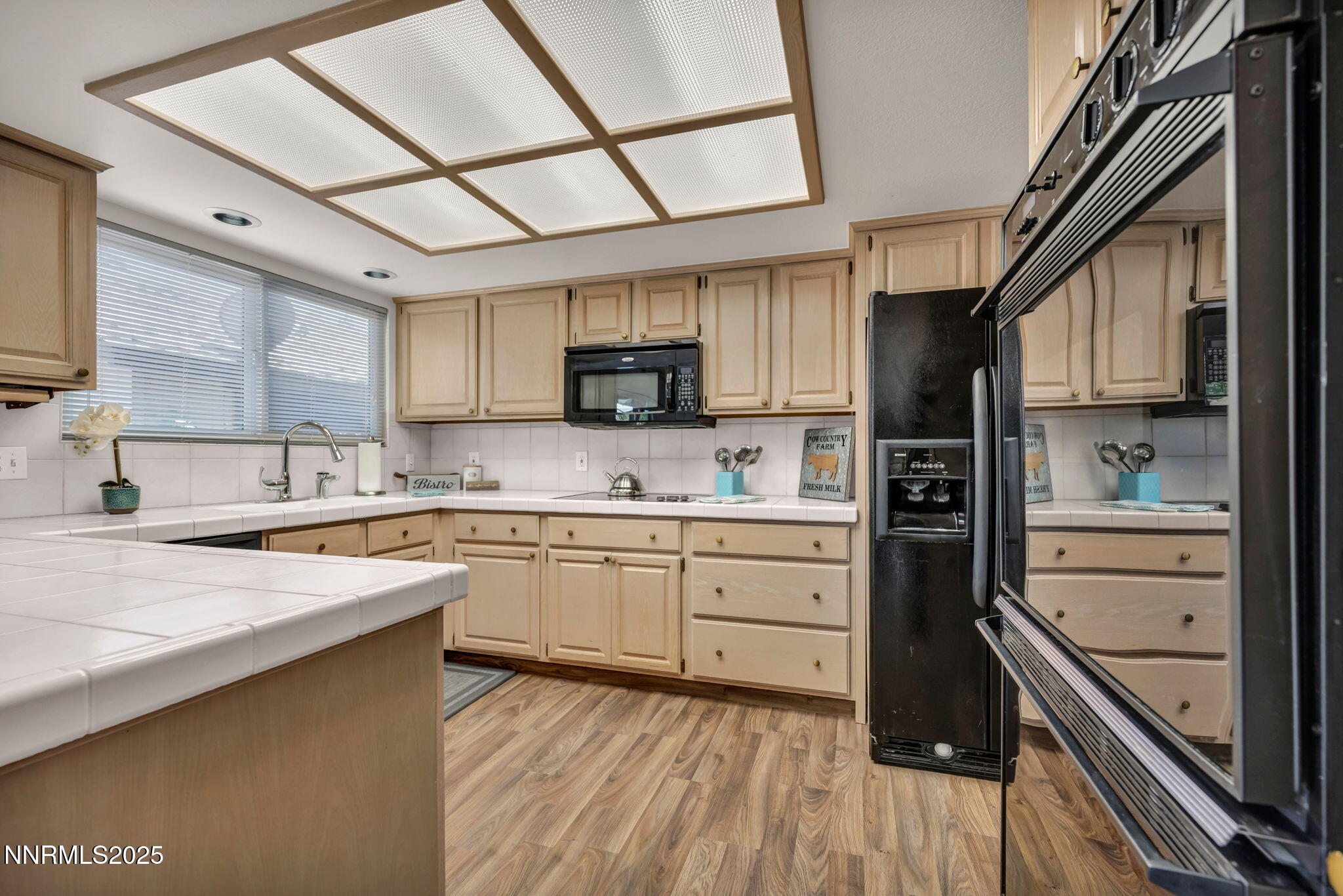 1481 Foster Drive Reno, NV 89509 - Photo 8 of 52 a kitchen with granite countertop a sink appliances cabinets and counter space