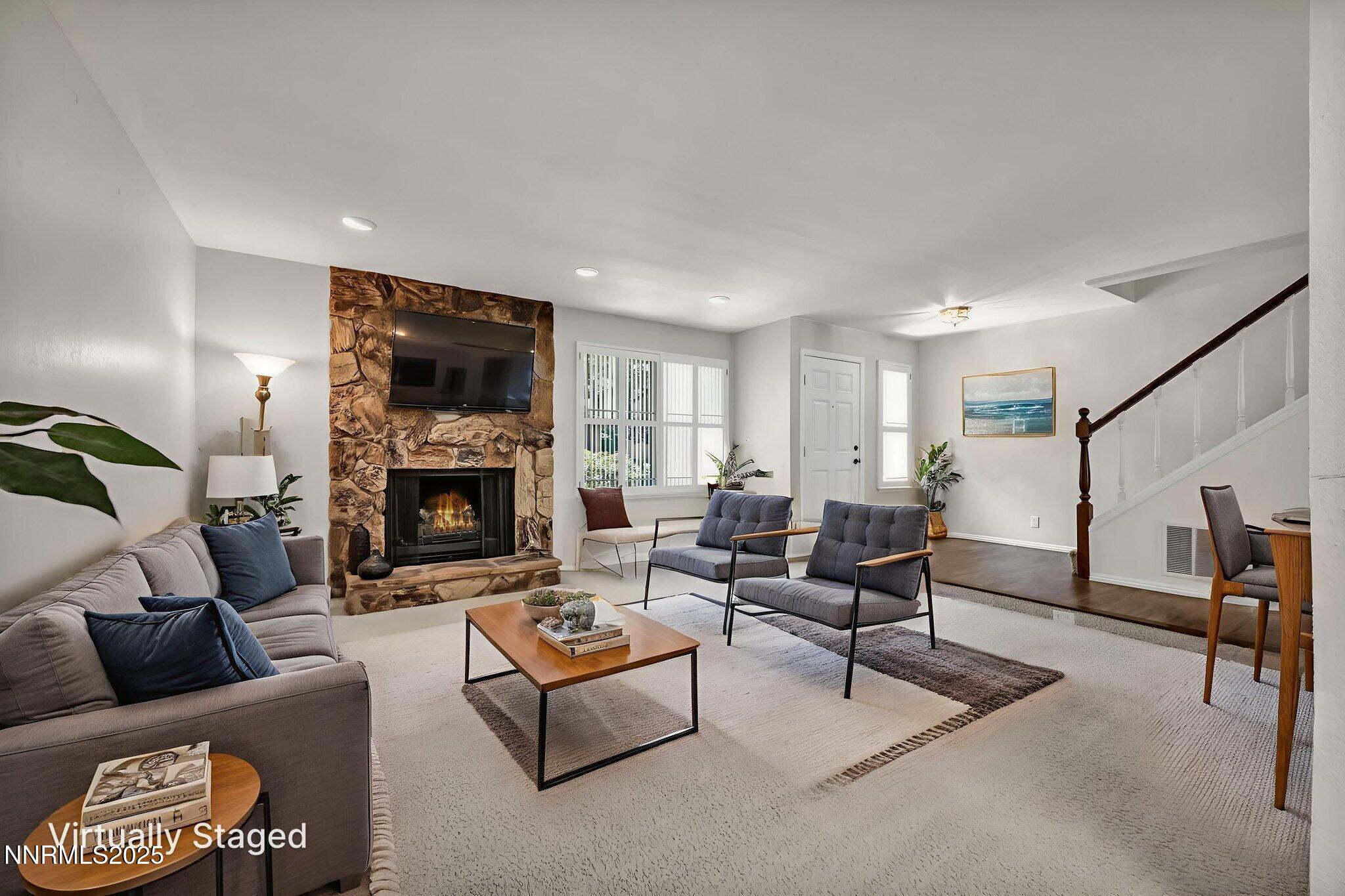 1481 Foster Drive Reno, NV 89509 - Photo 9 of 52 a living room with furniture fireplace and a flat screen tv