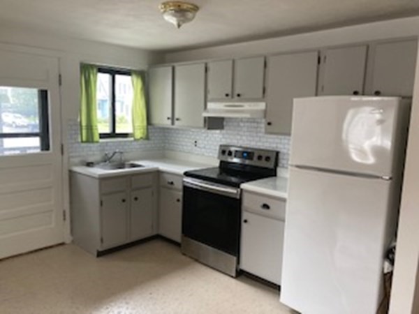 2 Winthrop Street, Unit 3 Watertown, MA 02472 - Photo 2 of 8 a kitchen with a refrigerator stove and sink