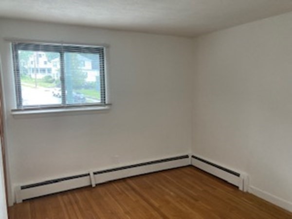 2 Winthrop Street, Unit 3 Watertown, MA 02472 - Photo 4 of 8 an empty room with a window