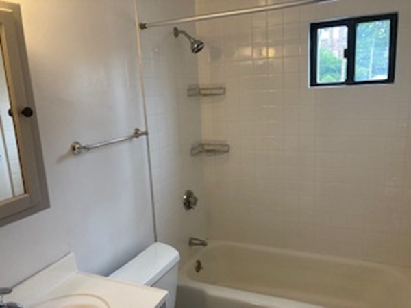 2 Winthrop Street, Unit 3 Watertown, MA 02472 - Photo 6 of 8 a bathroom with a toilet and a shower