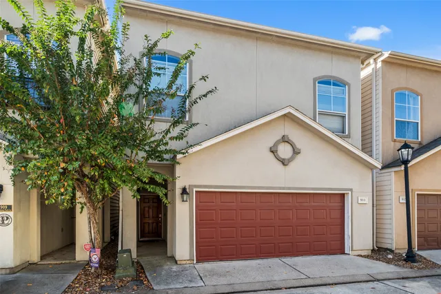 a front view of a house with garage