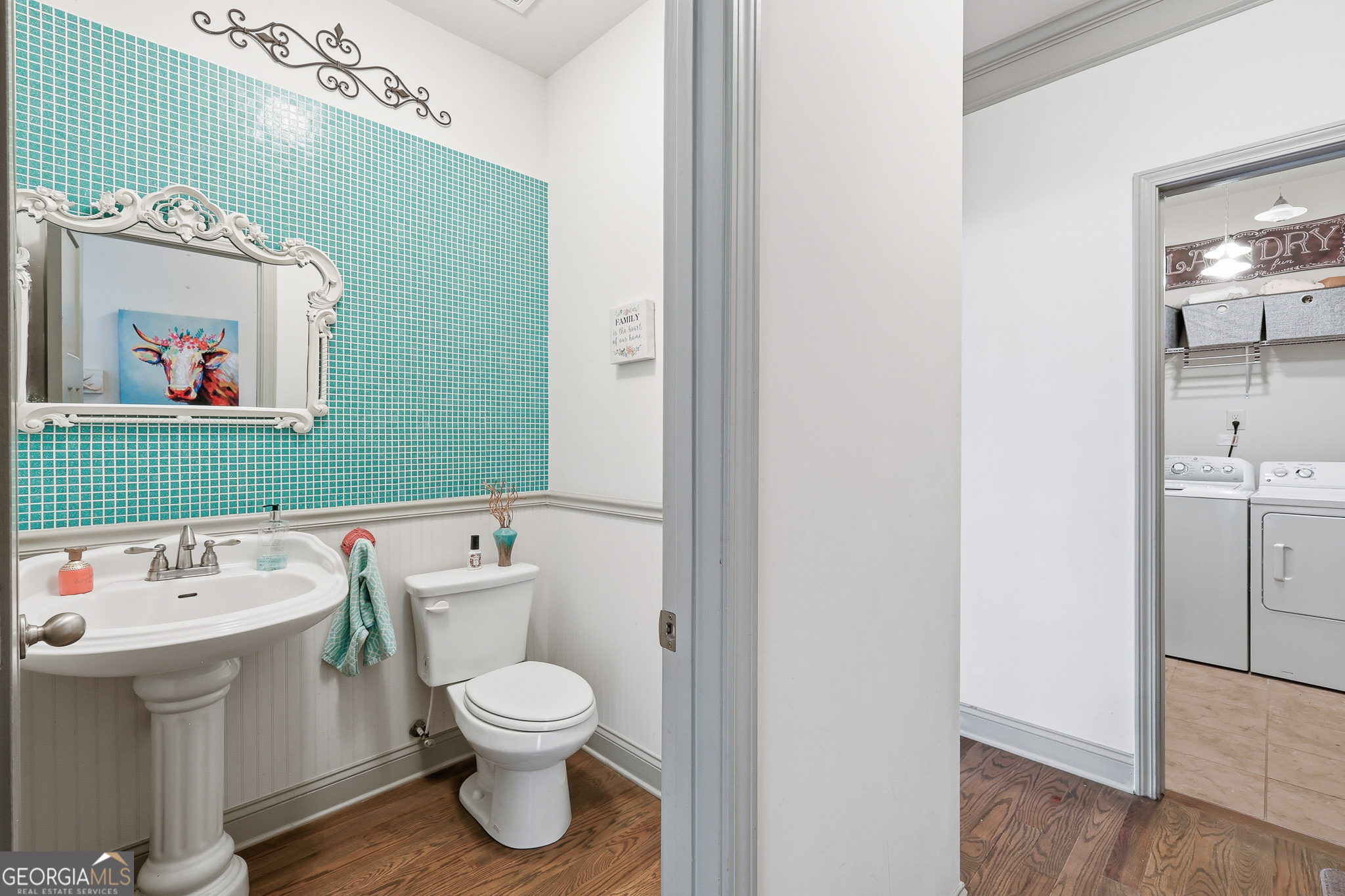 56 Creek Side Court Jefferson, GA 30549 - Photo 22 of 46 a bathroom with a toilet sink and mirror