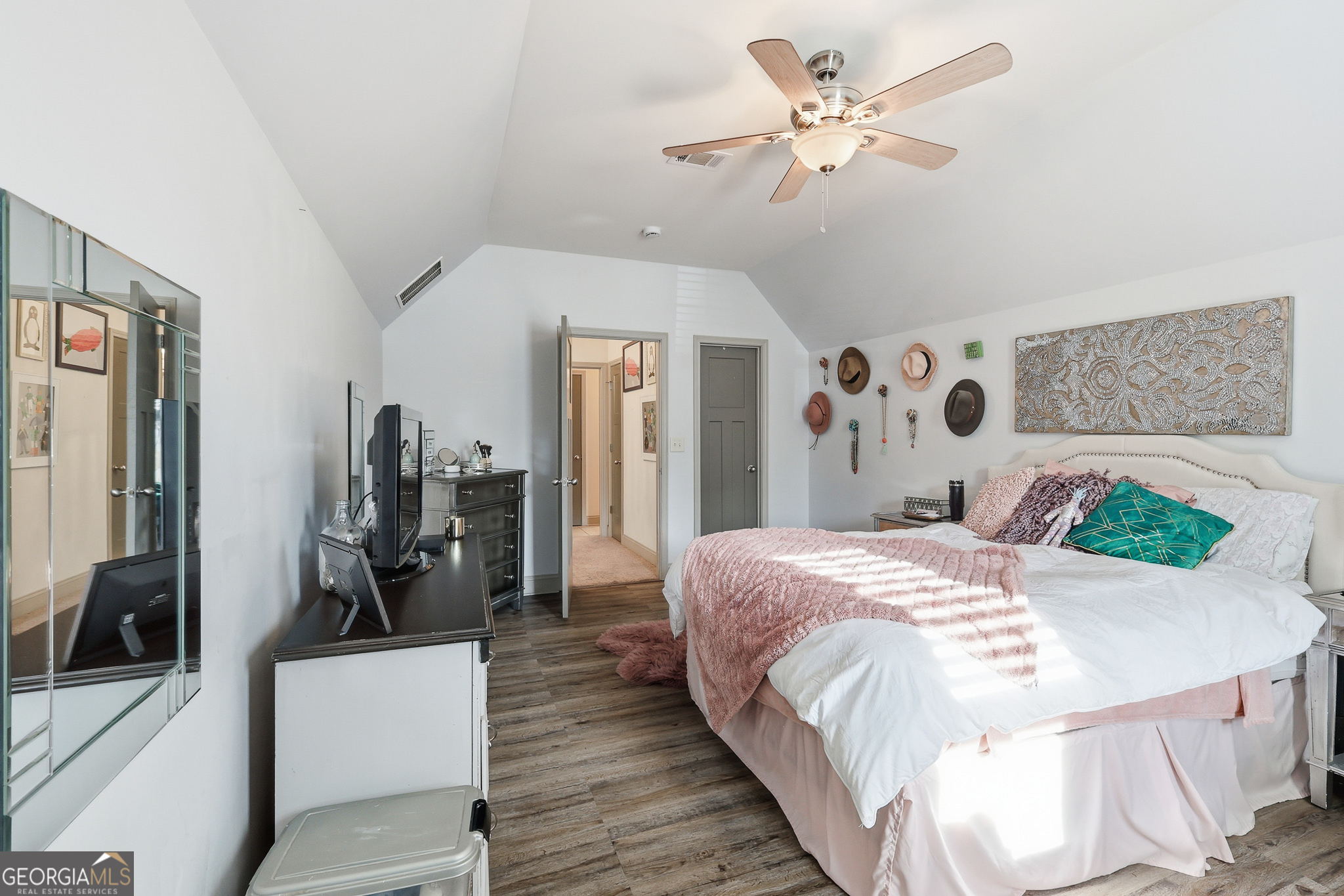 56 Creek Side Court Jefferson, GA 30549 - Photo 38 of 46 a bedroom with a bed and a chandelier