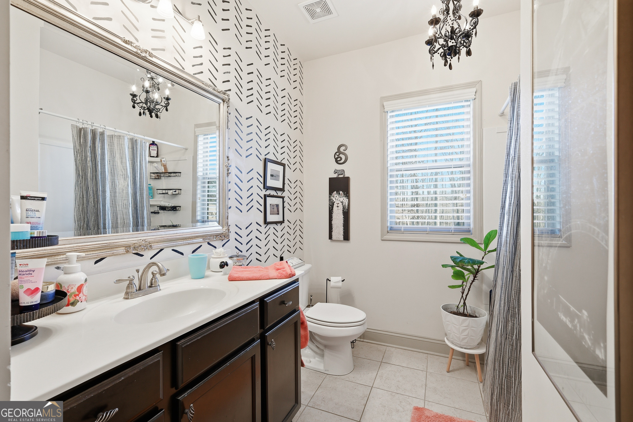 56 Creek Side Court Jefferson, GA 30549 - Photo 39 of 46 a bathroom with a sink a toilet and a large mirror