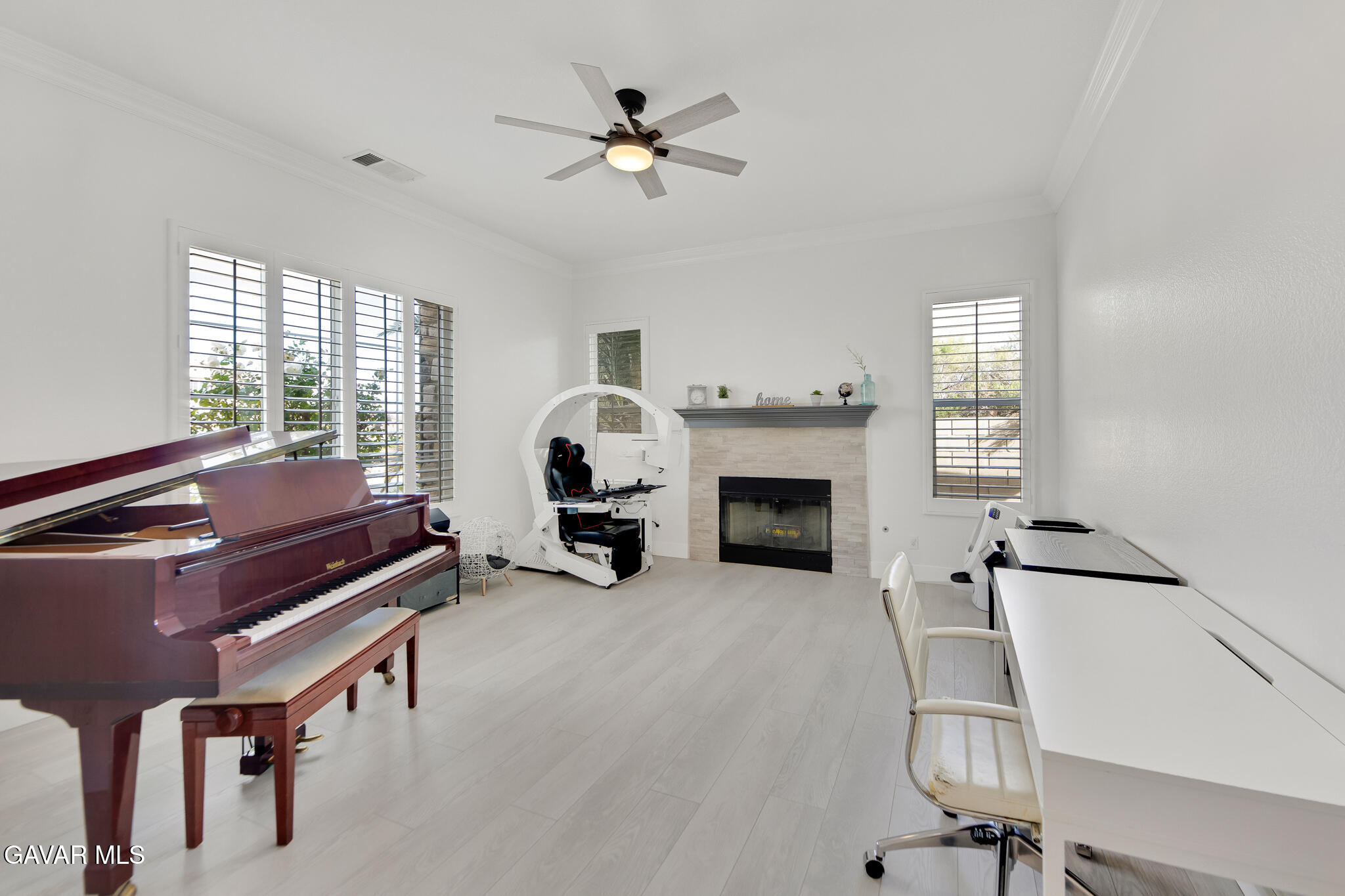 41632 Firenze Street Lancaster, CA 93536 - Photo 11 of 67 a living room with furniture and a fireplace
