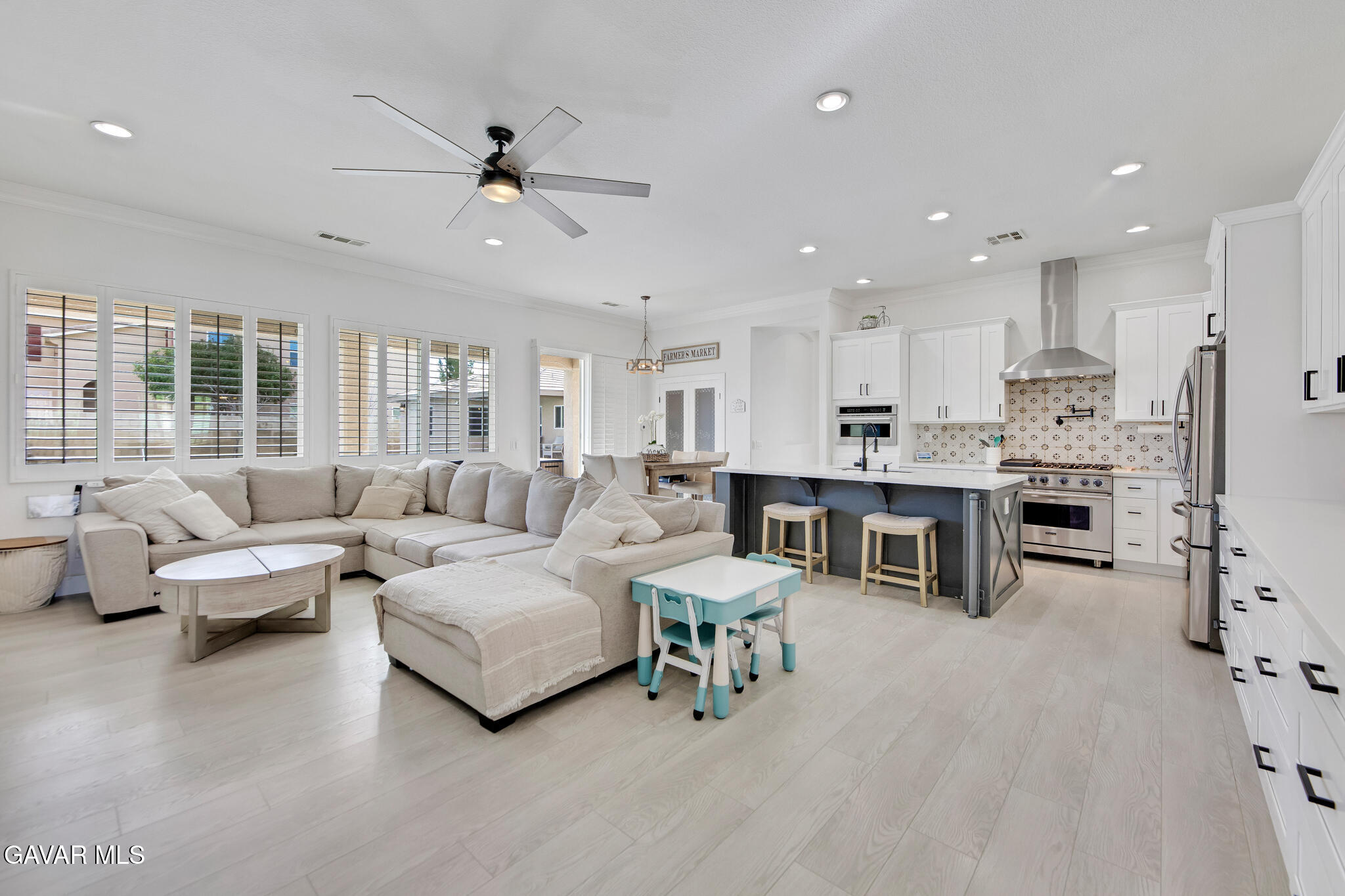 41632 Firenze Street Lancaster, CA 93536 - Photo 13 of 67 a living room with furniture and kitchen view