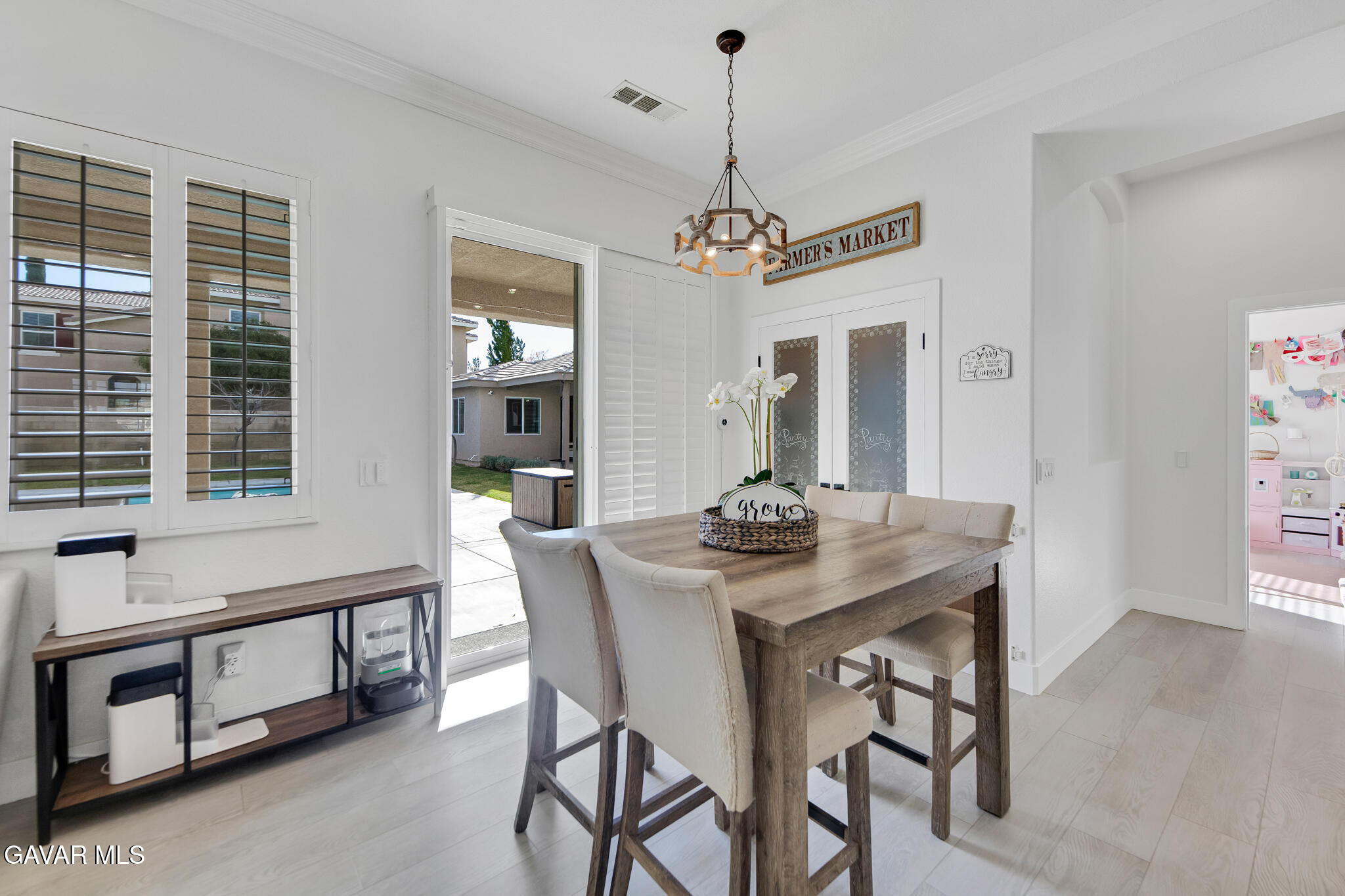 41632 Firenze Street Lancaster, CA 93536 - Photo 18 of 67 a view of a dining room with furniture window and wooden floor