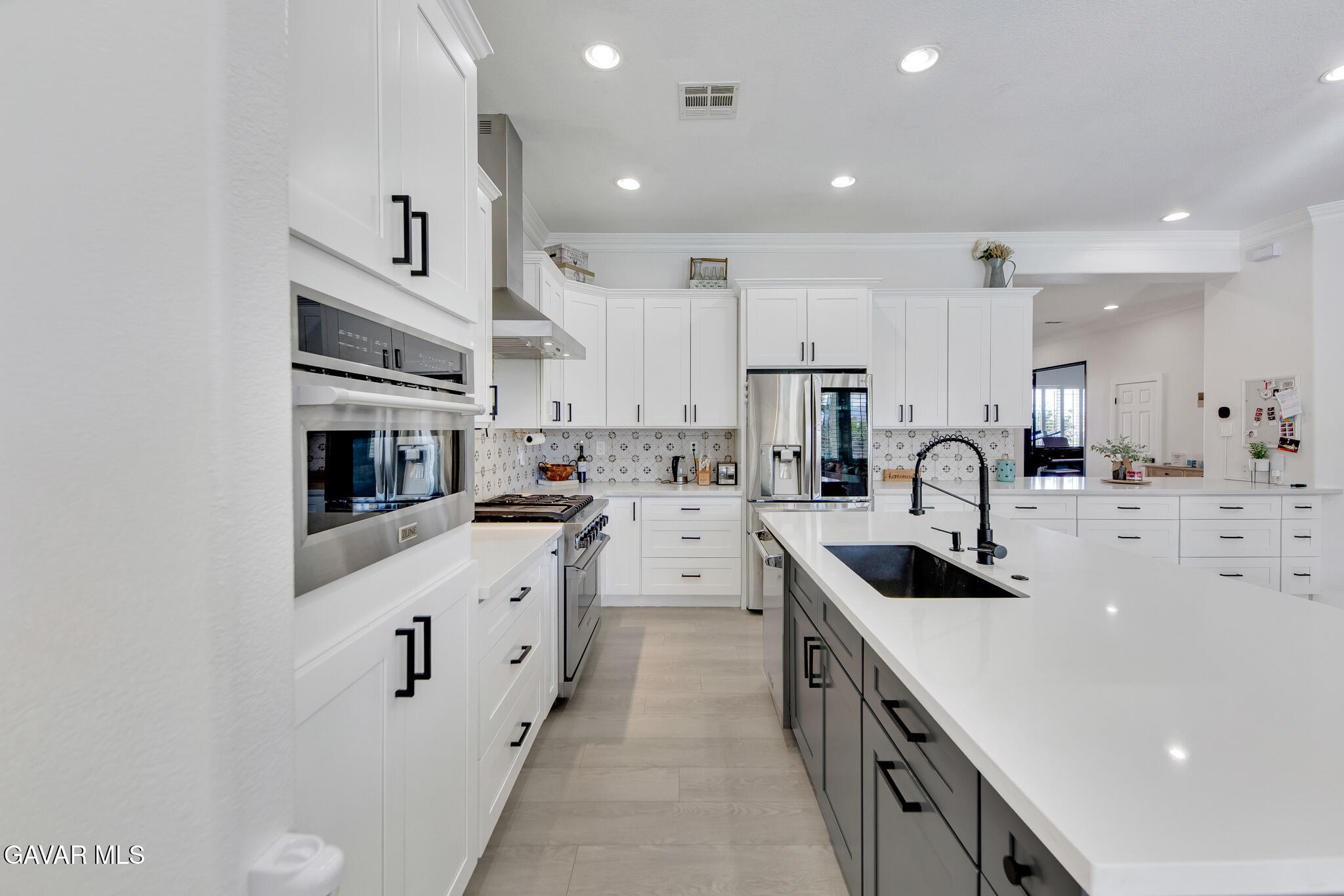 41632 Firenze Street Lancaster, CA 93536 - Photo 19 of 67 a kitchen with stainless steel appliances granite countertop a sink and cabinets