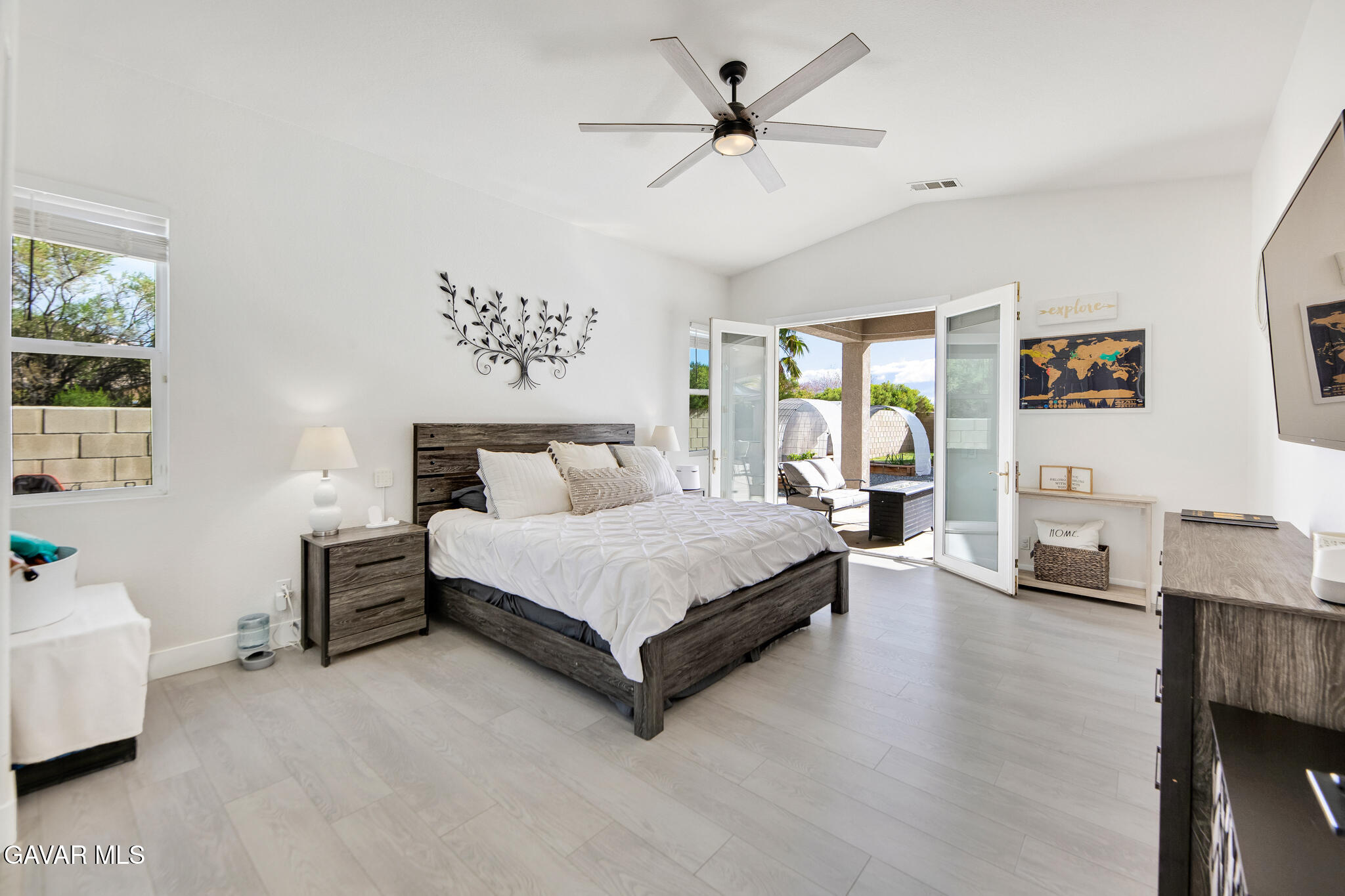 41632 Firenze Street Lancaster, CA 93536 - Photo 29 of 67 a spacious bedroom with a bed couch and a window