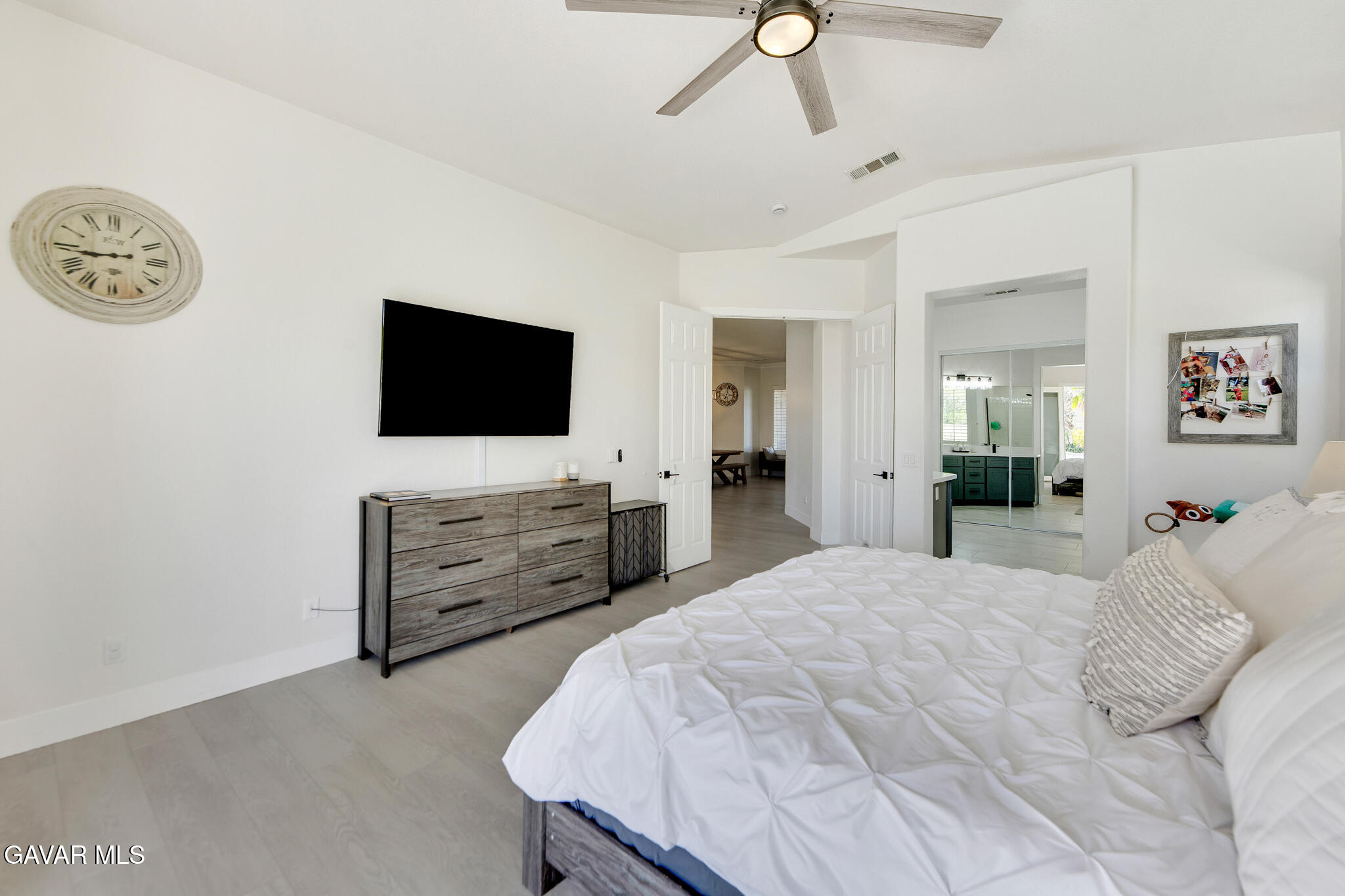 41632 Firenze Street Lancaster, CA 93536 - Photo 31 of 67 a bedroom with furniture and a flat screen tv