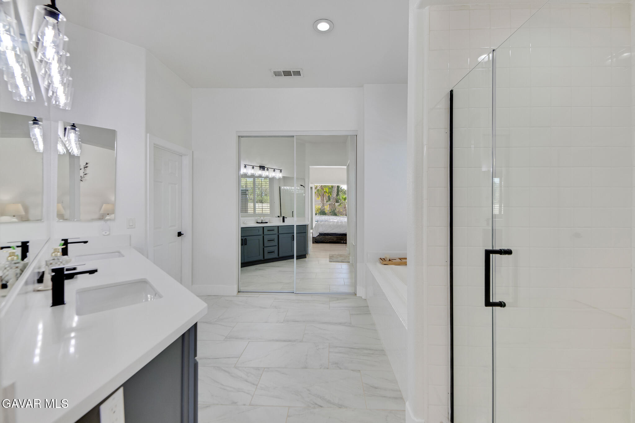 41632 Firenze Street Lancaster, CA 93536 - Photo 32 of 67 a en suite bathroom with a sink and a mirror