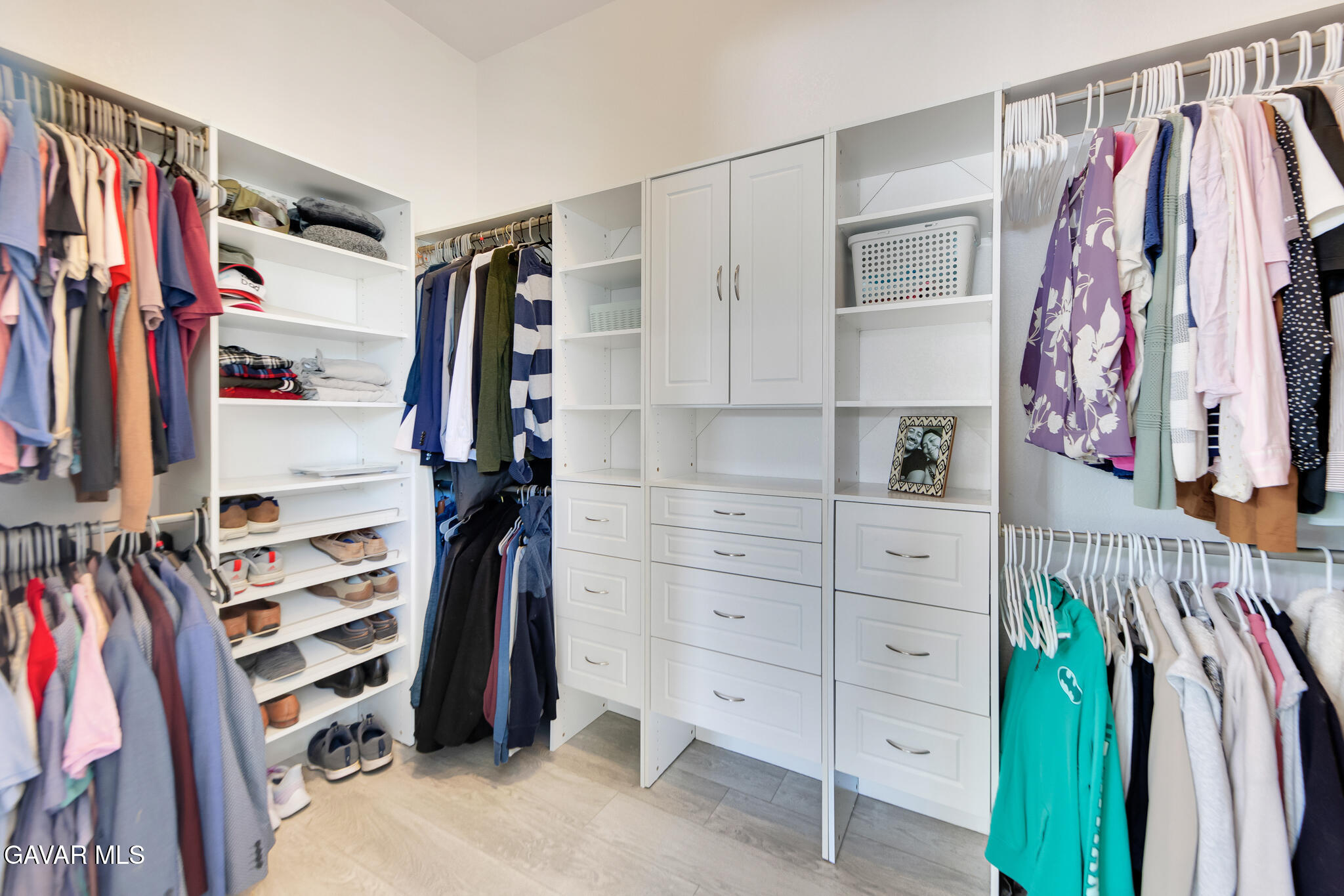 41632 Firenze Street Lancaster, CA 93536 - Photo 35 of 67 a view of walk in closet with clothes and shoes