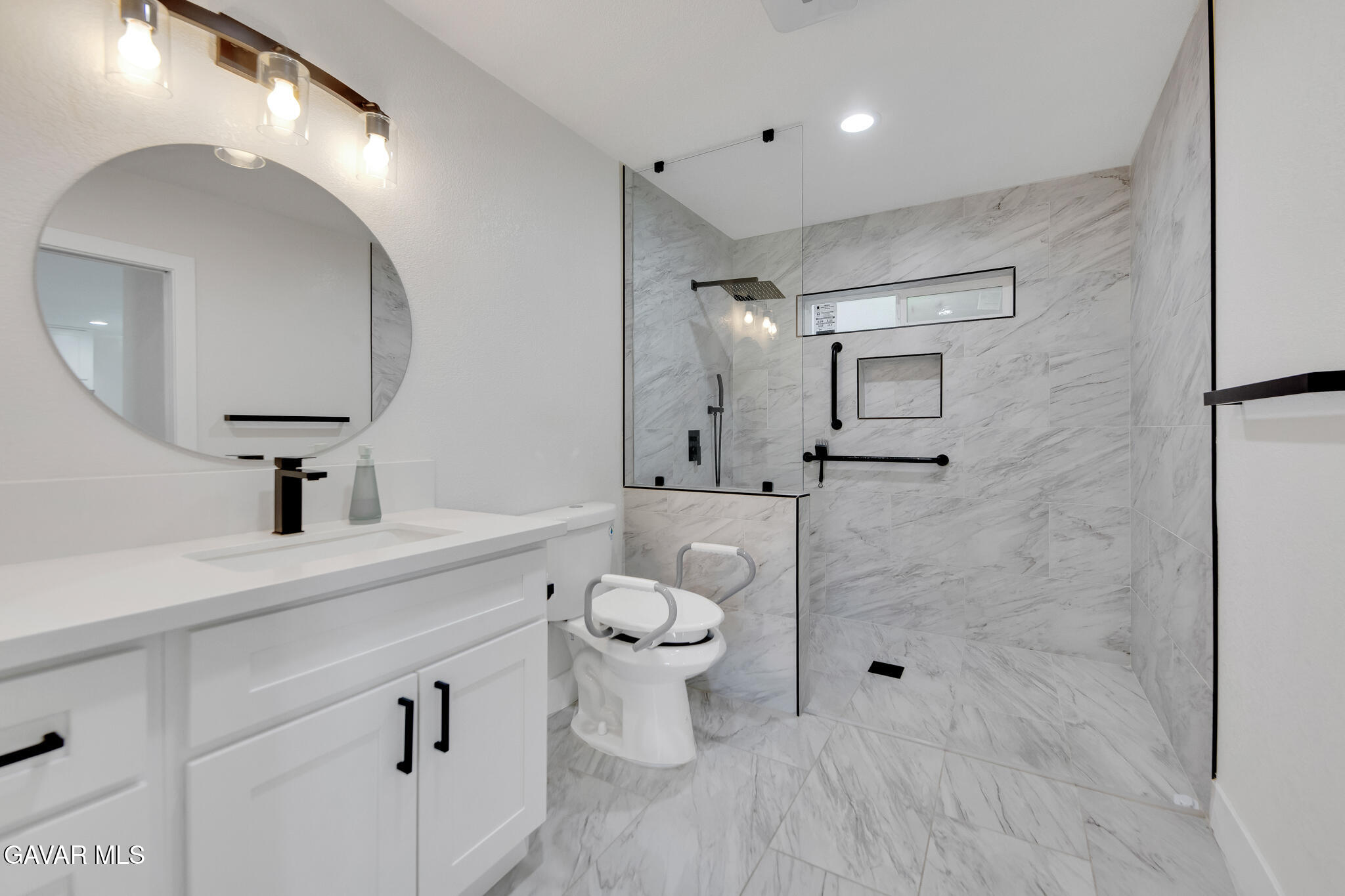 41632 Firenze Street Lancaster, CA 93536 - Photo 52 of 67 a bathroom with a toilet sink and mirror