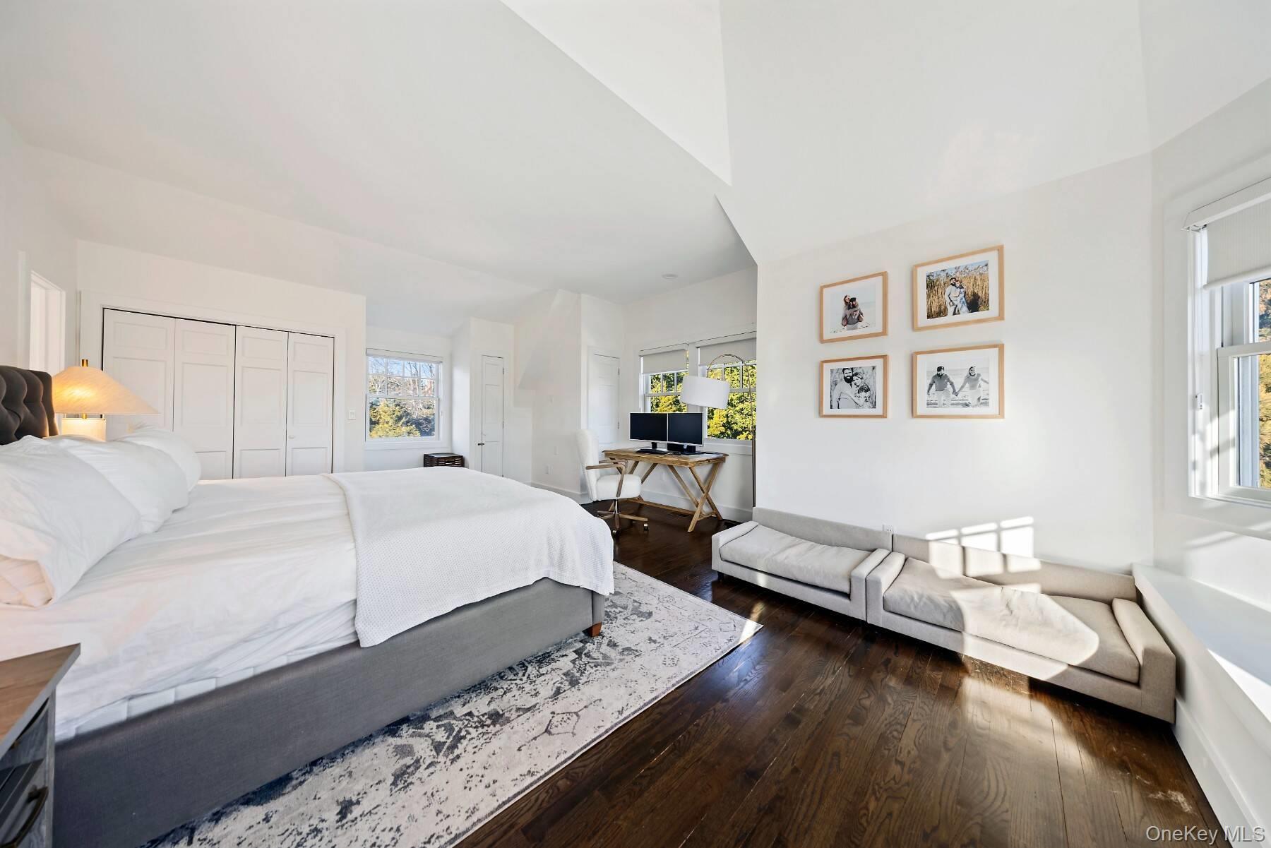 30 Exchange Place Westhampton Beach, NY 11978 - Photo 15 of 25 a bedroom with furniture and a wooden floor