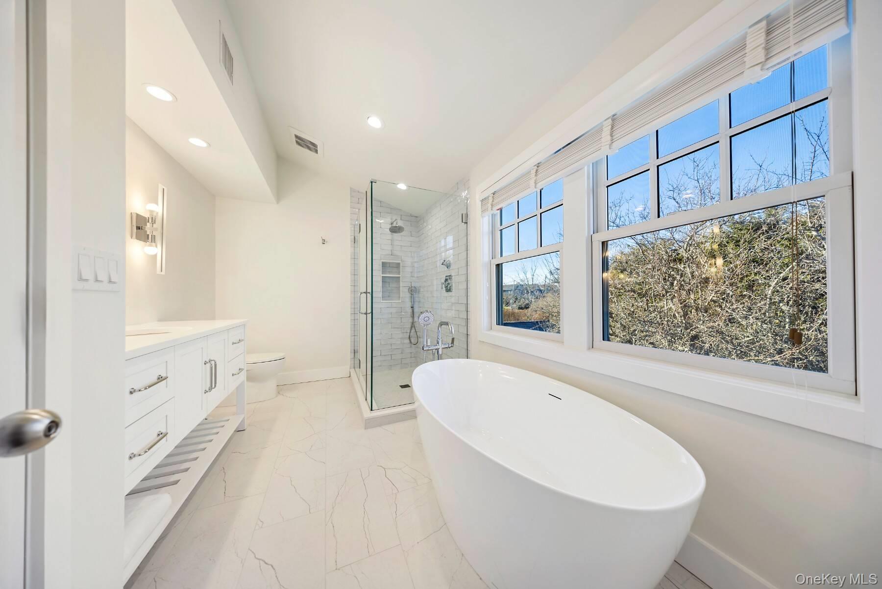 30 Exchange Place Westhampton Beach, NY 11978 - Photo 16 of 25 a bathroom with a bathtub and a shower