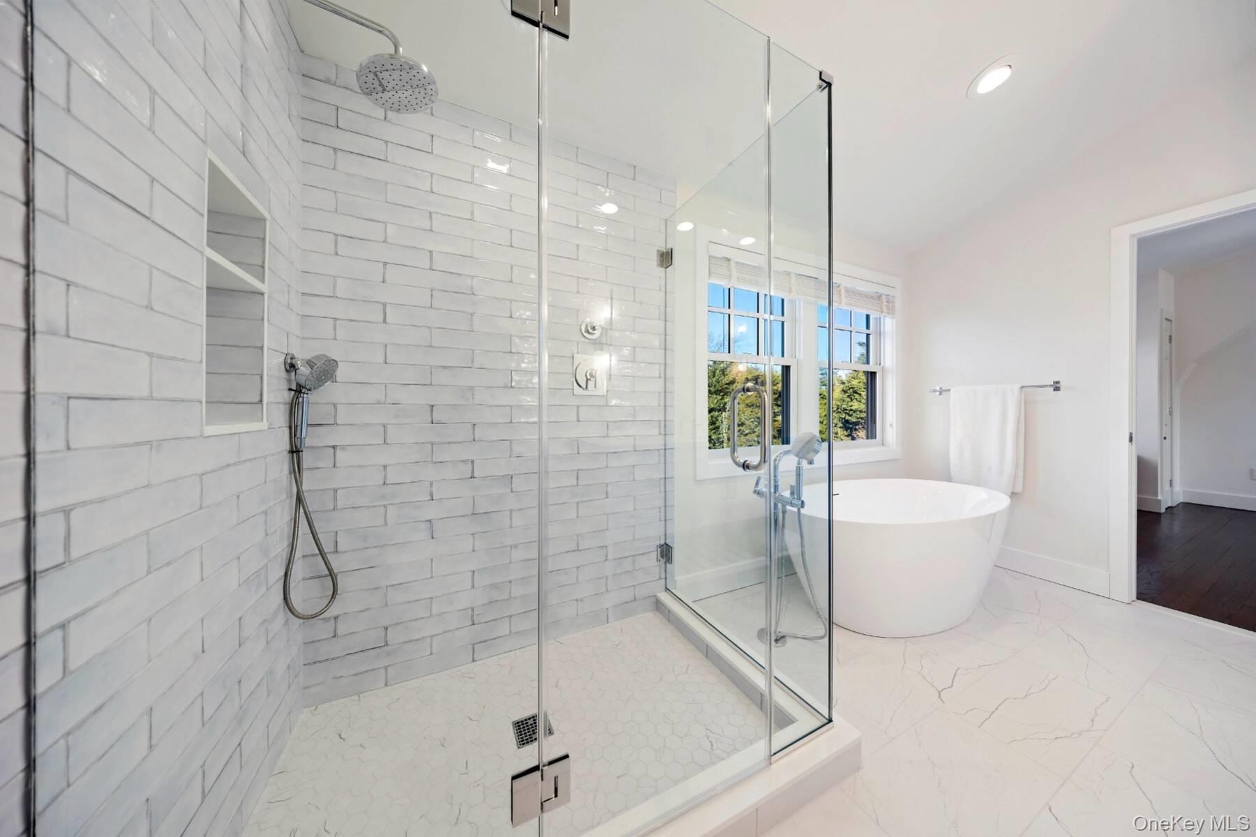 30 Exchange Place Westhampton Beach, NY 11978 - Photo 17 of 25 a bathroom with a granite countertop sink a toilet and bathtub